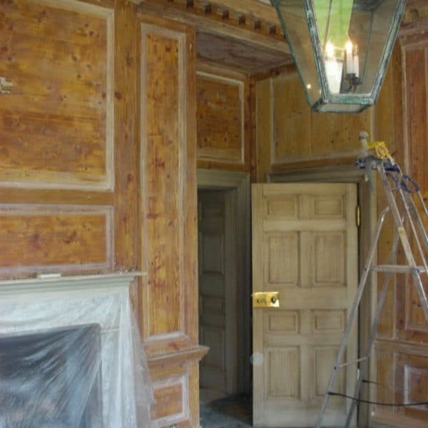 Removal of paint and French polish from pine paneling in Country Estate