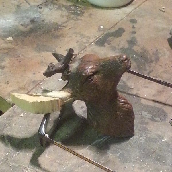 Reconstruction of broken antlers on bust of stag