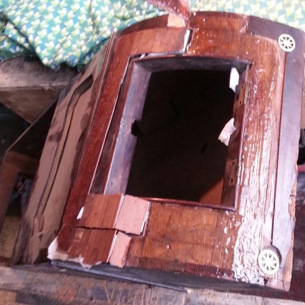 Restoration on 19th century dial clock constructed in mahogany veneer