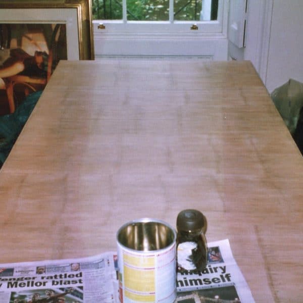 French polishing of contemporary bamboo-top dining table