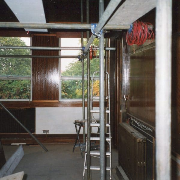 Restoration and French polishing on 20th century Boardroom paneling veneered in Australian walnut