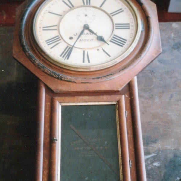 Revived wall clock constructed in walnut