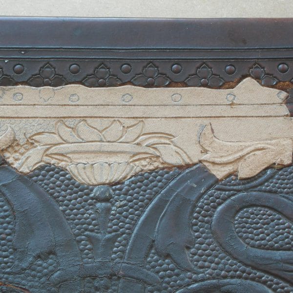 Leather repair with intricate detail